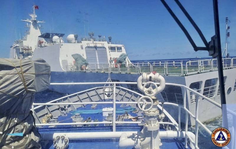 In this photo provided by the Philippine Coast Guard, a Chinese coast guard ship, front, allegedly blocks the path of a Philippine Coast Guard ship near the Philippine-occupied Second Thomas Shoal, South China Sea during a re-supply mission on Saturday Aug. 5, 2023.