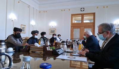 In this file photo released Jan. 31, 2021, by Tasnim News Agency, Iran's Foreign Minister Mohammad Javad Zarif, second right, meets with a Taliban political team, in Tehran, Iran.