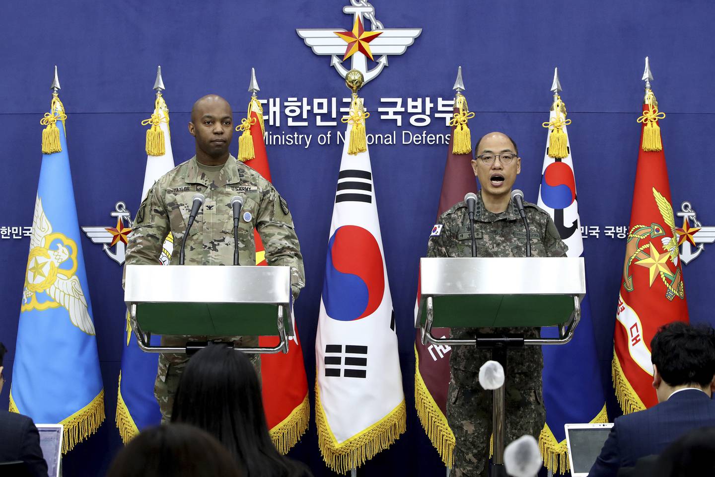 Col. Isaac Taylor, left, of the United Nations Command (UNC), Combined Forces Command (CFC), and United States Forces Korea (USFK) and Col. Lee Sung-jun of South Korea's Joint Chiefs of Staff attend the press briefing of the Freedom Shield Exercise at the Defense Ministry Friday, March 3, 2023 in Seoul, South Korea.