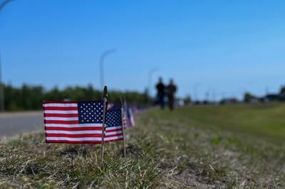 A line of flags is placed in remembrance of each member of the Department of Defense who was lost to suicide in 2021 at Minot Air Force Base, North Dakota, Sept. 1, 2022.