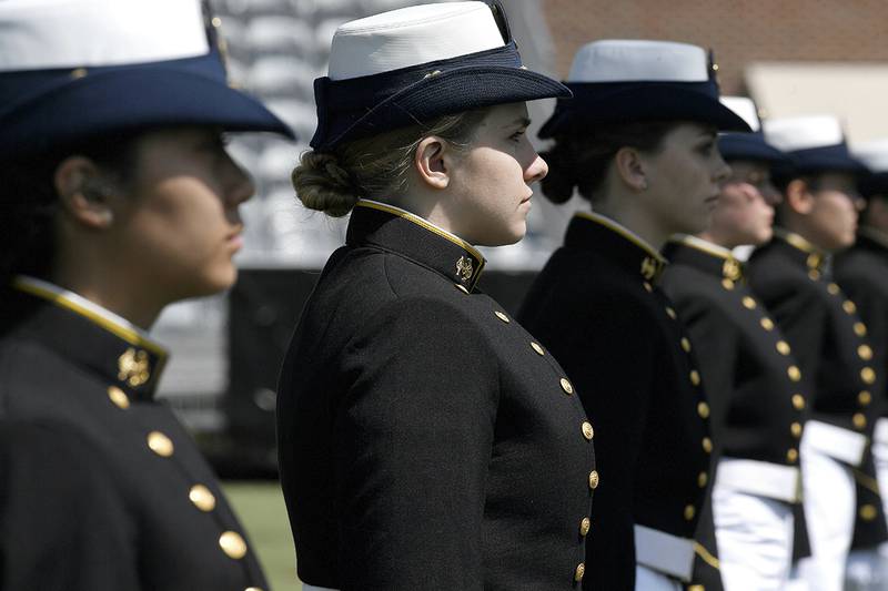 In this May 22, 2019, file photo, female cadets at the United States Coast Guard Academy line up during commencement in New London, Conn.