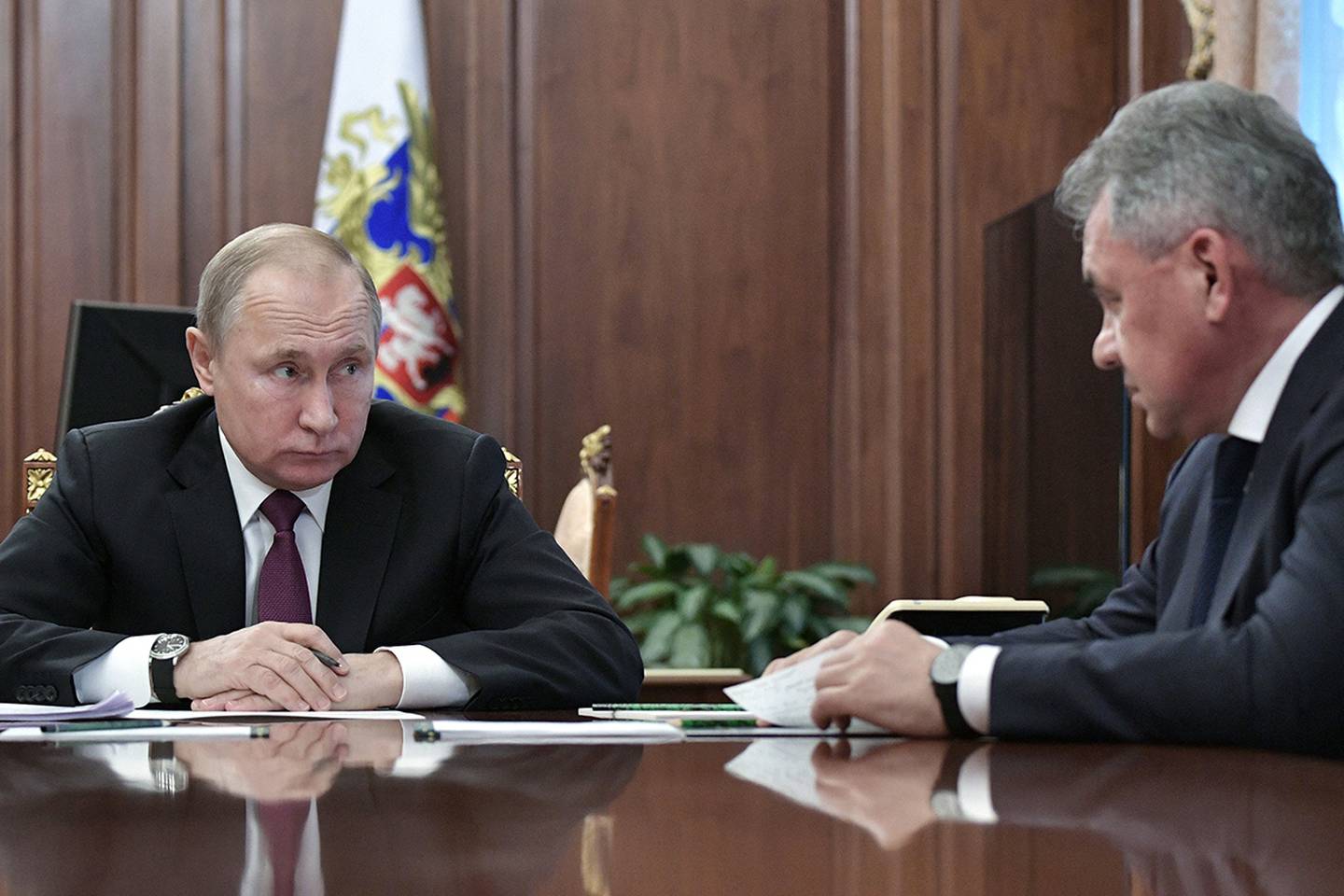 In this Feb. 2, 2019, file photo, Russian President Vladimir Putin, left, speaks to Defense Minister Sergei Shoigu during a meeting in the Kremlin in Moscow.