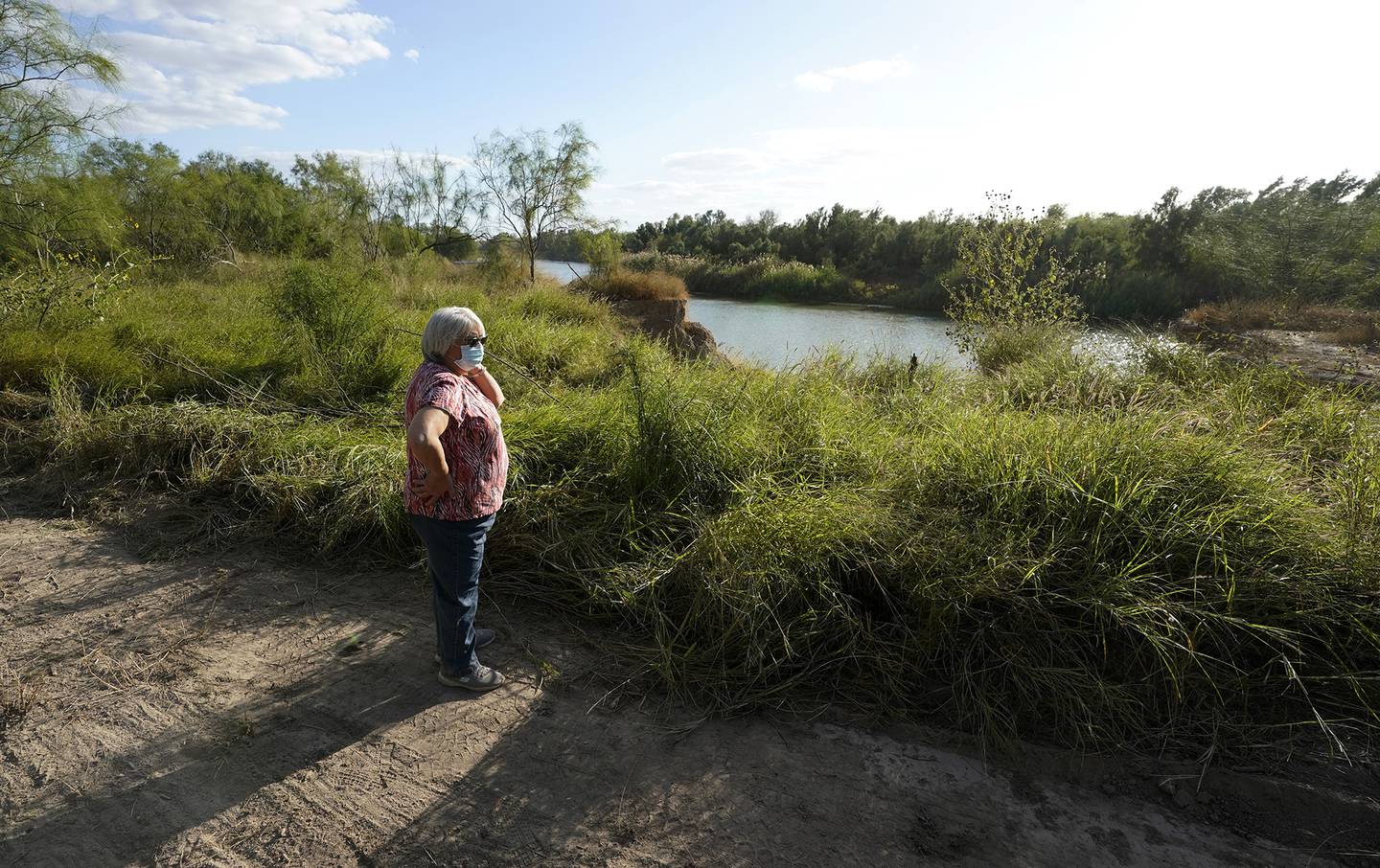 Pamela Rivas stands on her property that runs along the Rio Grande in Los Ebanos, Texas, Friday, Nov. 20, 2020.
