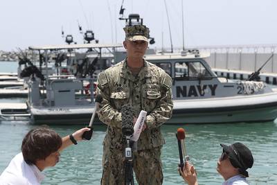 Cmdr. Sean Kido of the U.S. Navy's 5th Fleet talks to journalists