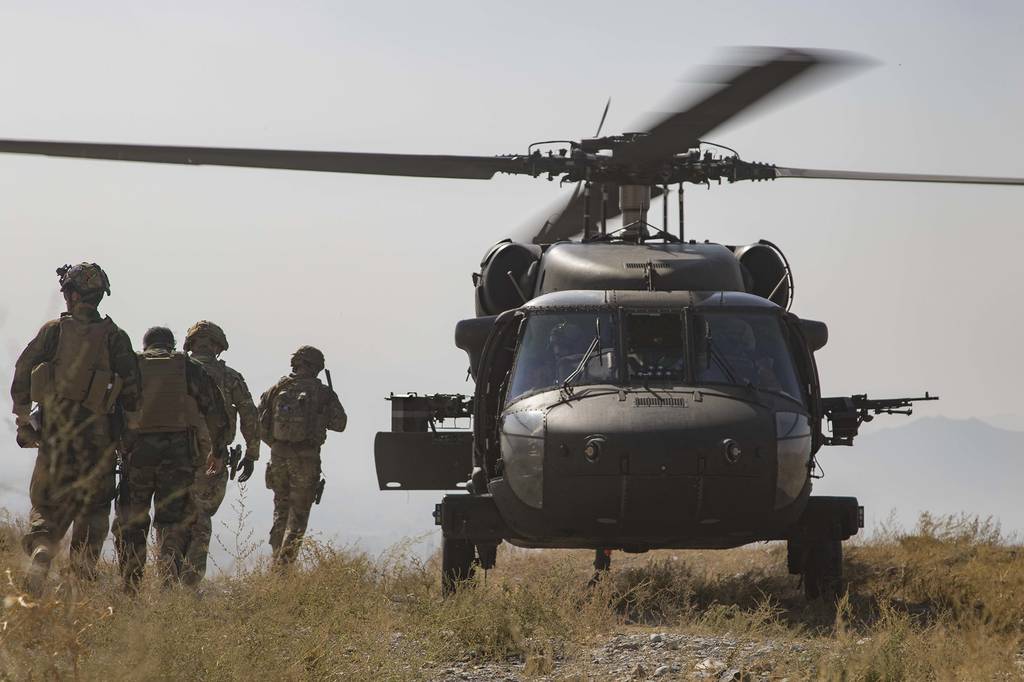 Afghan National Army soldiers and coalition advisers assigned prepare to board a UH-60 Black Hawk helicopter following the completion of a key stage of an Afghan-led and executed clearance operation to safeguard Afghan civilians in southeastern Afghanistan, Sept 25, 2019.