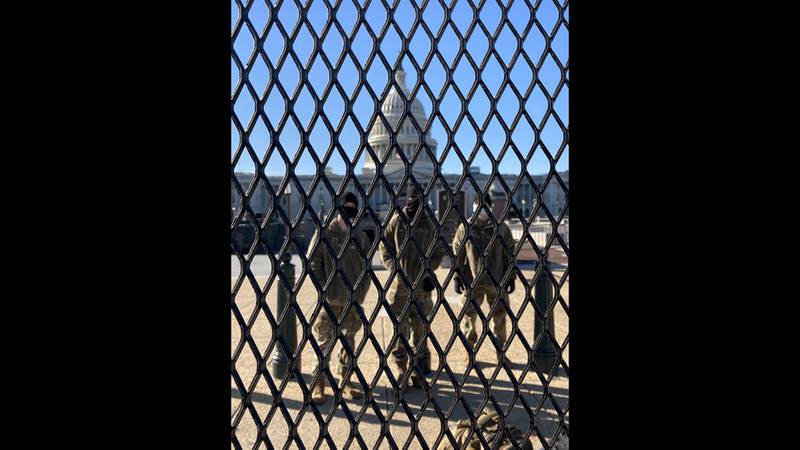 National Guard troops stand watch at the Capitol in the wake of the deadly Jan. 6 riot by supporters of Donald Trump.