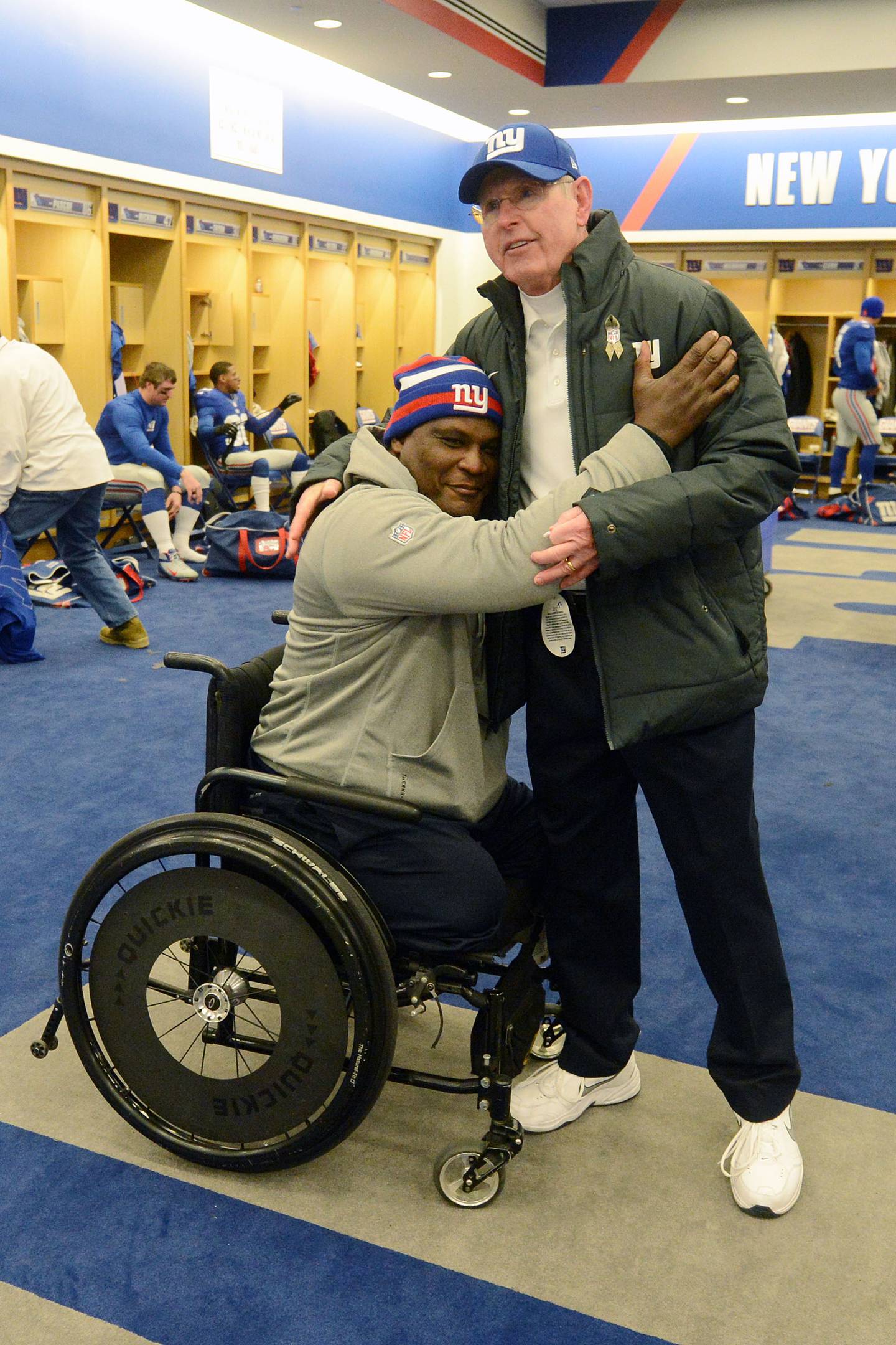 Giants Coach Tom Coughlin and Greg Gadson embrace in the team locker
room following a victory against the Green Bay Packers in November 2012.