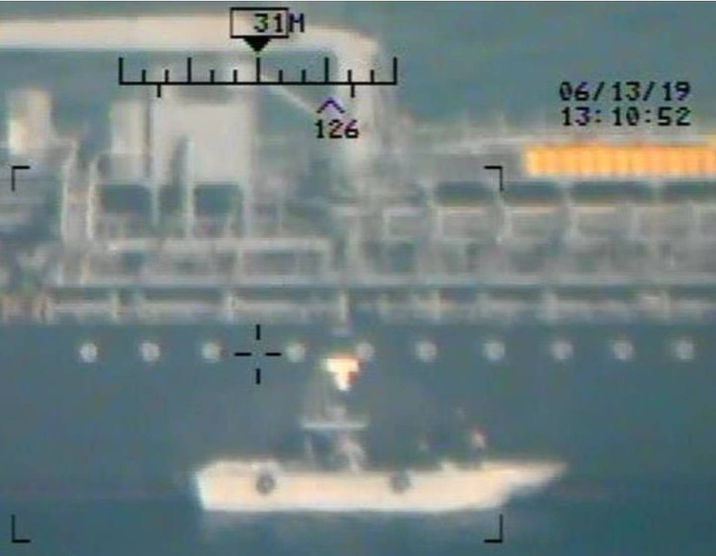 Imagery taken from a U.S. Navy MH-60R helicopter of the Islamic Revolutionary Guard Corps Navy after removing an unexploded limpet mine from the M/T Kokuka Courageous (CENTCOM)