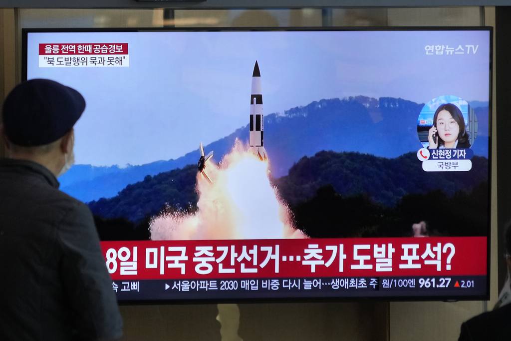 A TV screen shows a file image of North Korea's missile launch during a news program at the Seoul Railway Station in Seoul, South Korea, Wednesday, Nov. 2, 2022.