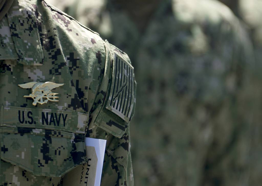 Members of SEAL Qualification Training Class 336 wear their newly earned Special Warfare (SEAL) pins, known as “Tridents,” during their graduation ceremony at Naval Special Warfare (NSW) Center in Coronado, Calif., April 15, 2020.