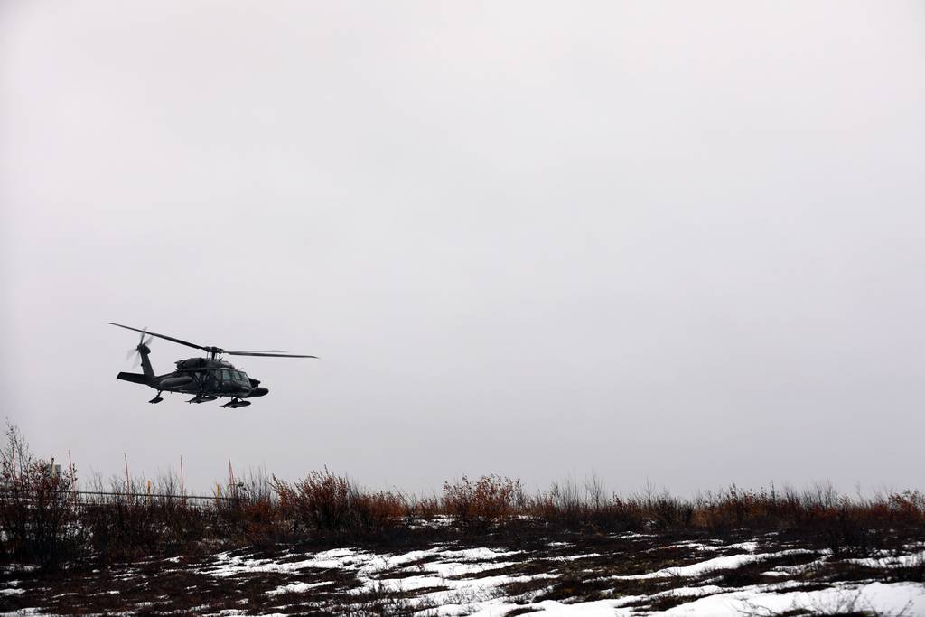 This photo provided by the Alaska National Guard shows an Alaska Army National Guard UH-60L Black Hawk helicopter equipped with two LifeMed flight paramedics and essential medical equipment departing the Army Aviation Operating Facility in Bethel , Alaska en route to Napaskiak during a medevac mission, Wednesday, Nov. 15, 2023.