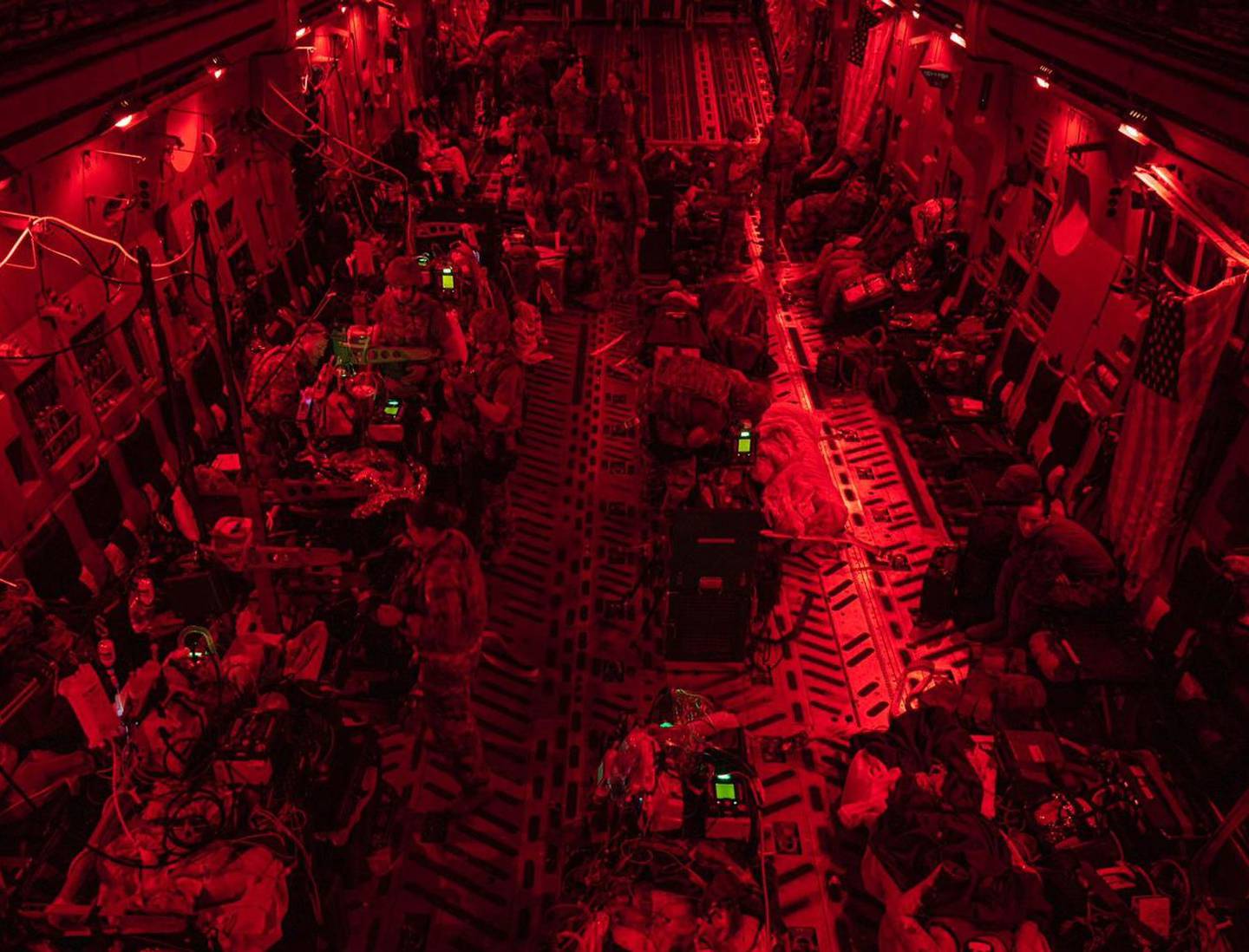 A photo taken at the end of August 2021 shows one of the first aeromedical evacuation flights out following the suicide bombing at the Kabul airport. It carried the most critically wounded from Hamid Karzai International Airport to Germany. Each green light is a ventilator and indicates a patient on life support. (Courtesy of Capt. Carlos Mendoza/Air Force)