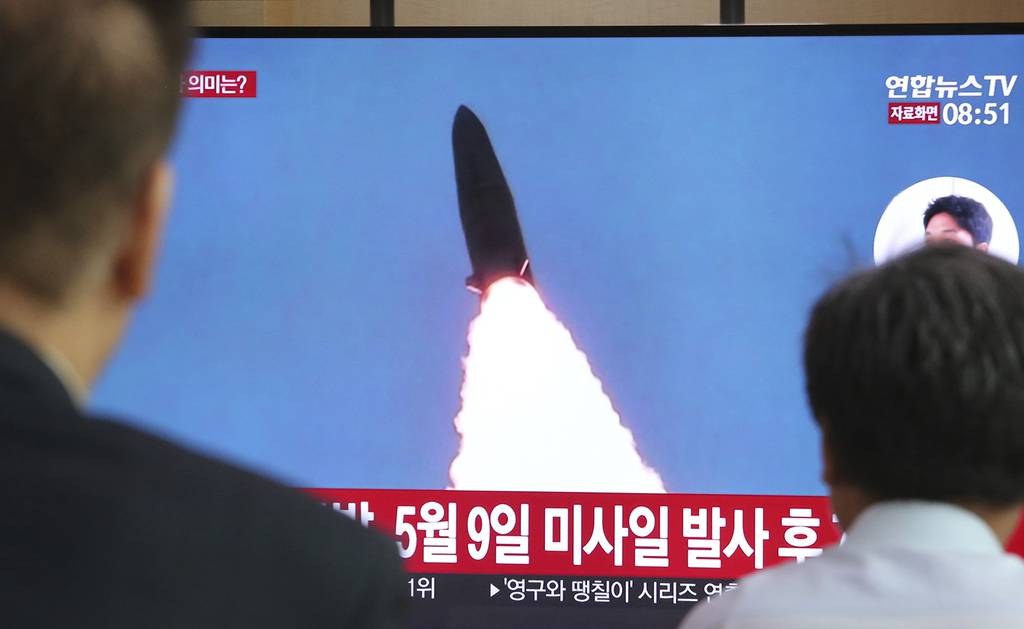 People watch a TV showing a file image of North Korea's missile launch during a news program at the Seoul Railway Station in Seoul, South Korea, Thursday, July 25, 2019.