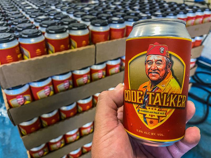 In this Aug. 14, 2020, photo LT Goodluck holds a beer can honoring his grandfather, Navajo Code Talker John V. Goodluck at the Hellbender Brewing Co., in Washington, D.C.