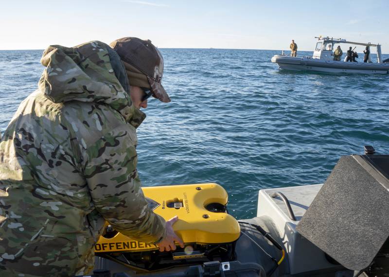 Sailors prepare an underwater vehicle to search for debris during recovery efforts of a high altitude balloon in the Atlantic Ocean, Feb. 7, 2023.
