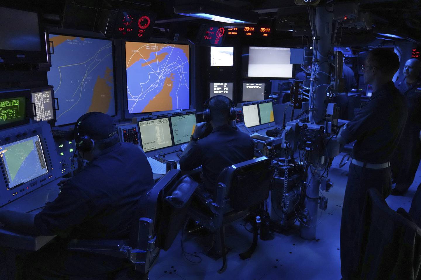 U.S. Navy sailors work in the Combat Information Center of the USS Paul Hamilton in the Strait of Hormuz Friday, May 19, 2023.