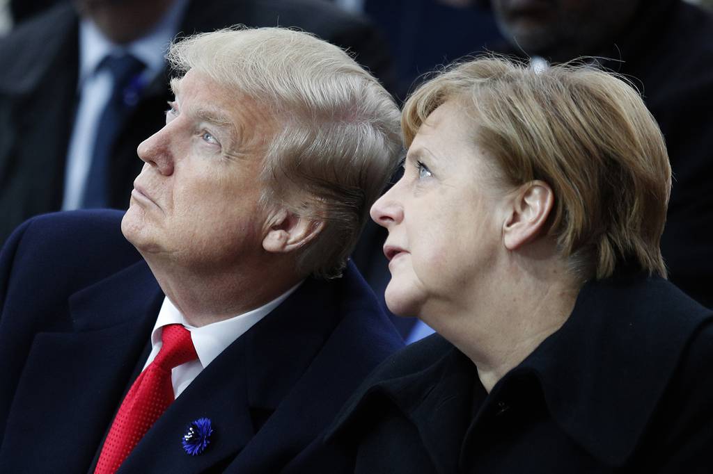 In this Nov. 11, 2018, file photo, U.S. President Donald Trump and German Chancellor Angela Merkel attend ceremonies at the Arc de Triumphe in Paris.