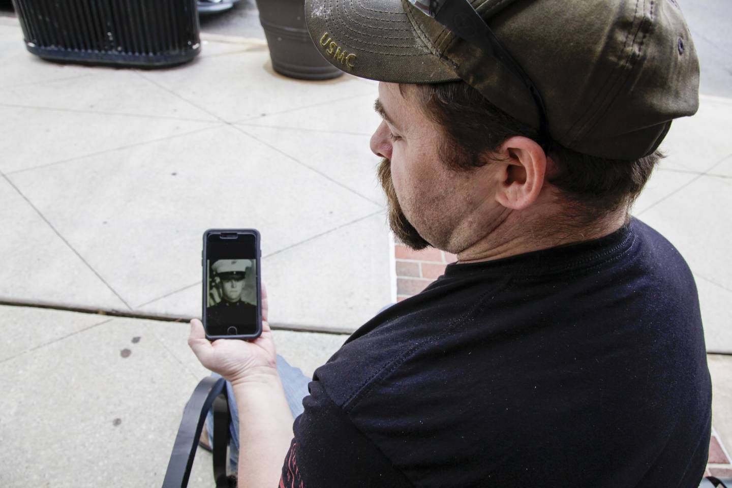 Marine Corps veteran Chad Sneary, 43, shows a photo of his 19-year-old self in uniform on Thursday, April 30, 2020, in Mooresville, N.C.