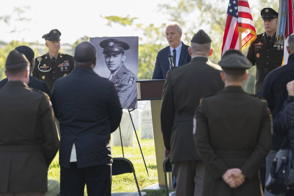 Sen. Chris Van Hollen, D-Md., speaks during a medal ceremony for Cpl. Waverly B. Woodson Jr., to be posthumously honored with the Bronze Star and Combat Medic Badge at Arlington National Cemetery on Tuesday, Oct. 11, 2023 in Arlington, Va.