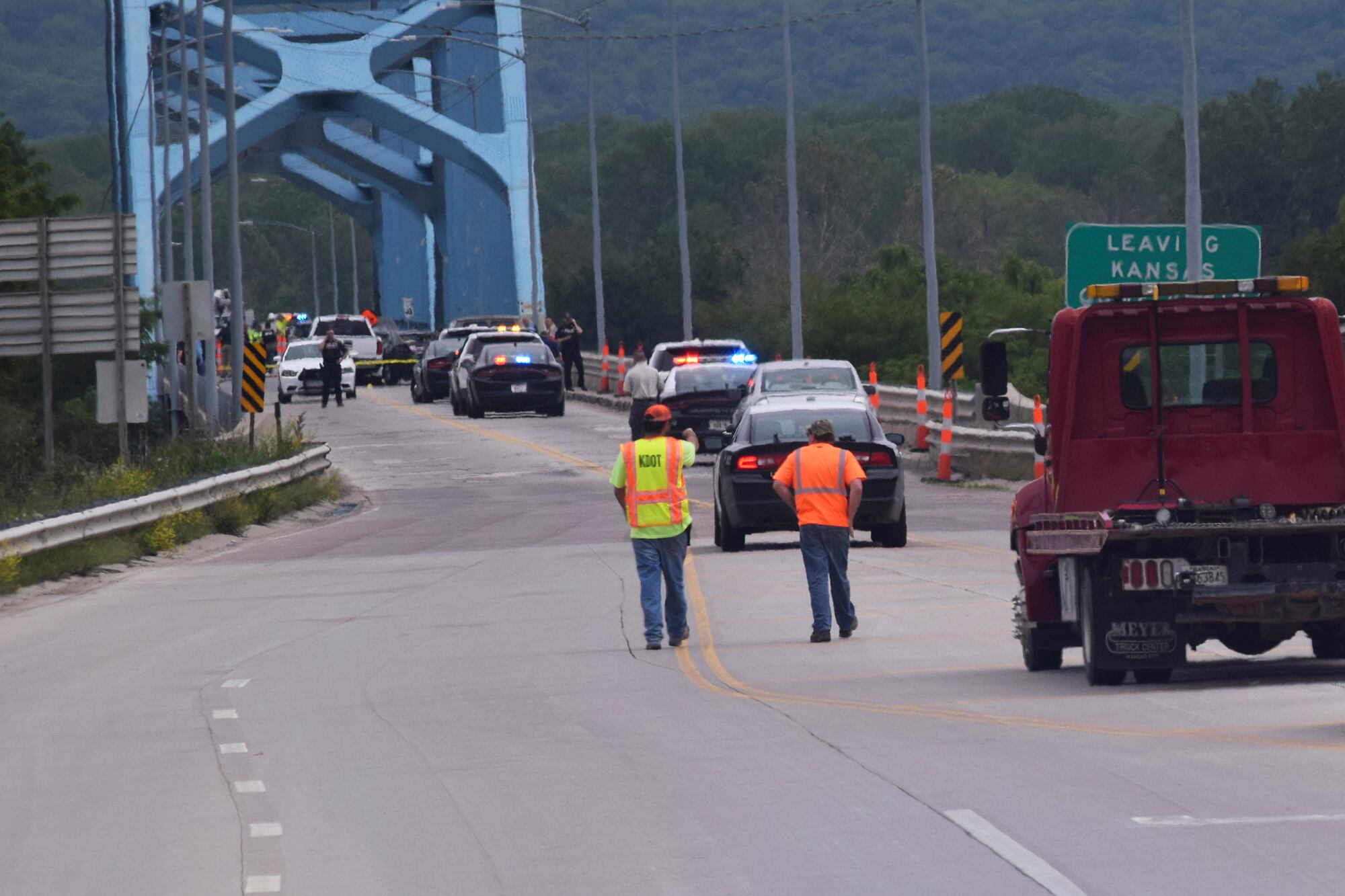 Authorities gather on Centennial Bridge after a shooting Wednesday, May 27, 2020, near Leavenworth, Kan.