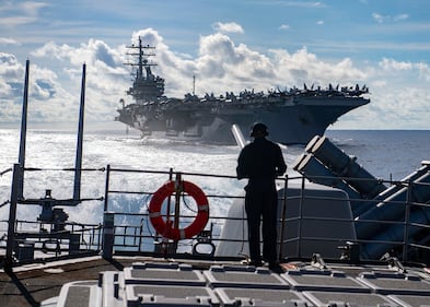Seaman Marcus White stands watch as aft lookout aboard the Ticonderoga-class guided-missile cruiser USS Chancellorsville (CG 62) on June 30, 2019, during a replenishment-at-sea with the Nimitz-class aircraft carrier USS Ronald Reagan (CVN 76) in the Philippine Sea.