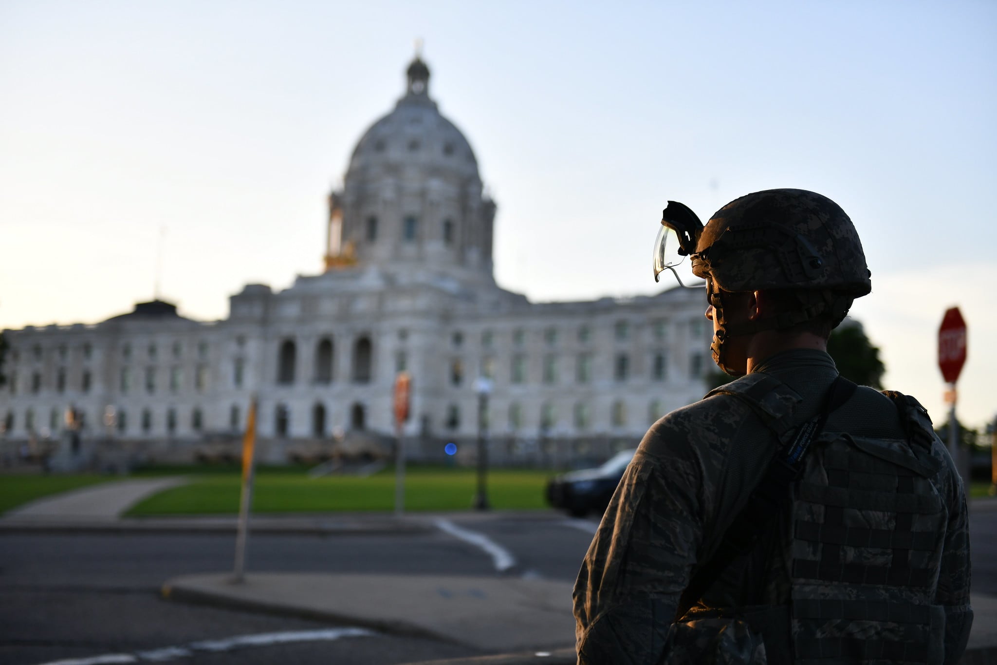At the grounds of the Minnesota state capitol on June 1, 2020, the Minnesota National Guard stood to protect citizens and infrastructure as people protested on the steps of the capitol building.