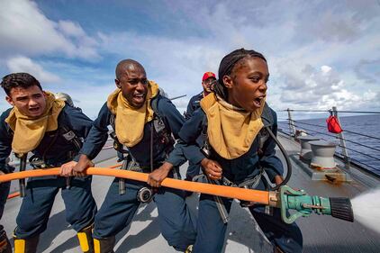 Sailors practice proper firefighting techniques during a damage control training drill June 26, 2019, aboard the Arleigh Burke-class guided-missile destroyer USS McCampbell (DDG 85) in the Philippine Sea.