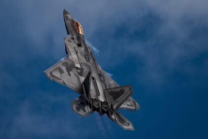 Air Force Maj. Paul "Loco" Lopez, F-22 Demo Team commander and pilot, performs the "tail slide" maneuver during an aerial demonstration at the SkyFest air show in Spokane. Wash., June 22, 2019.