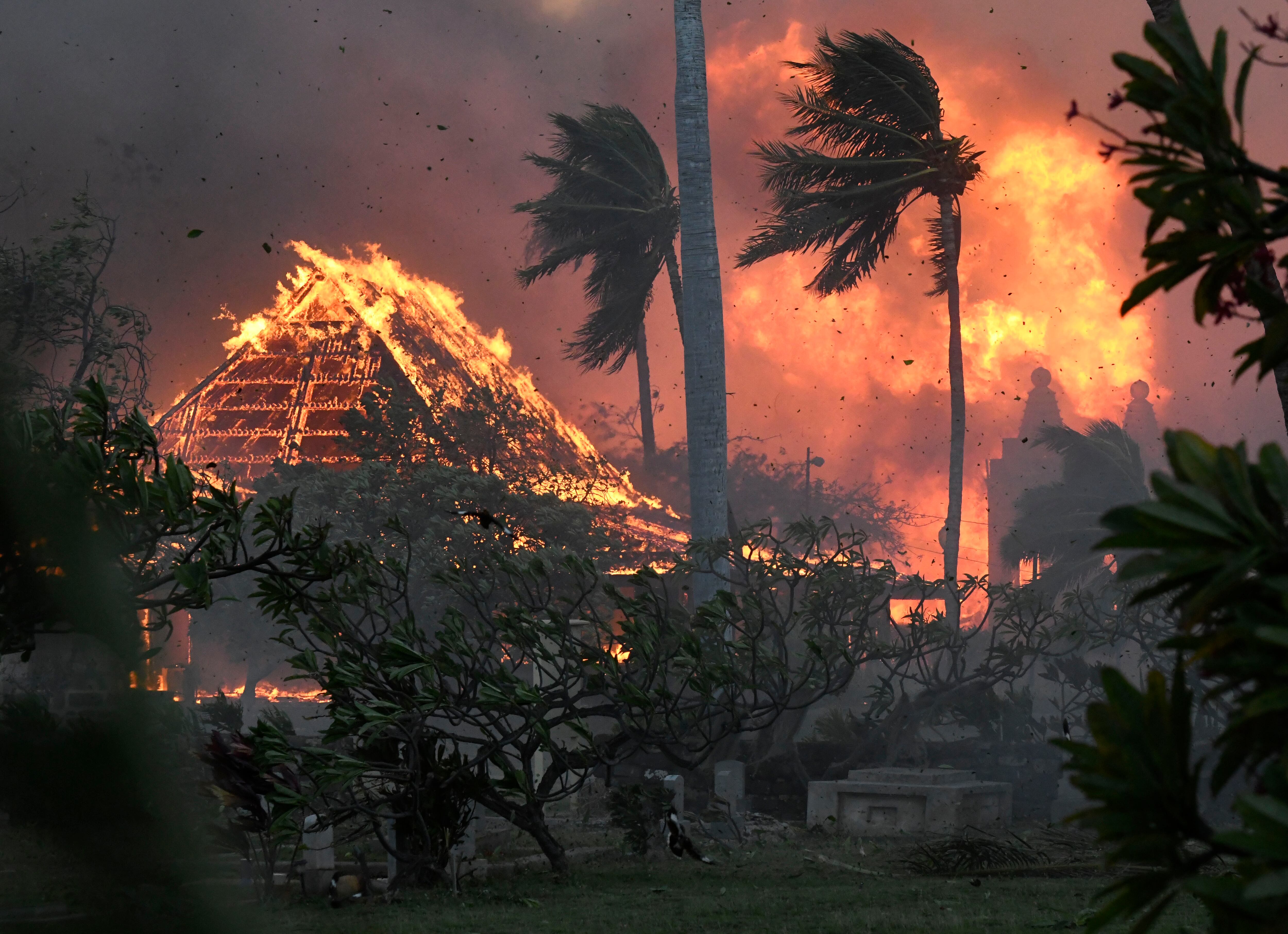 The hall of historic Waiola Church in Lahaina and nearby Lahaina Hongwanji Mission are engulfed in flames along Wainee Street, Aug. 8, 2023, in Lahaina, Hawaii.