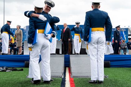 President Donald Trump congratulates cadets at the U.S. Air Force Academy graduation at Falcon Stadium in Colorado Springs, Colo.