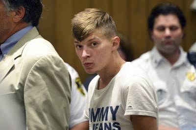 In this June 24, 2019, file photo, Volodymyr Zhukovskyy, of West Springfield, Mass., stands during his arraignment in district court in Springfield, Mass.