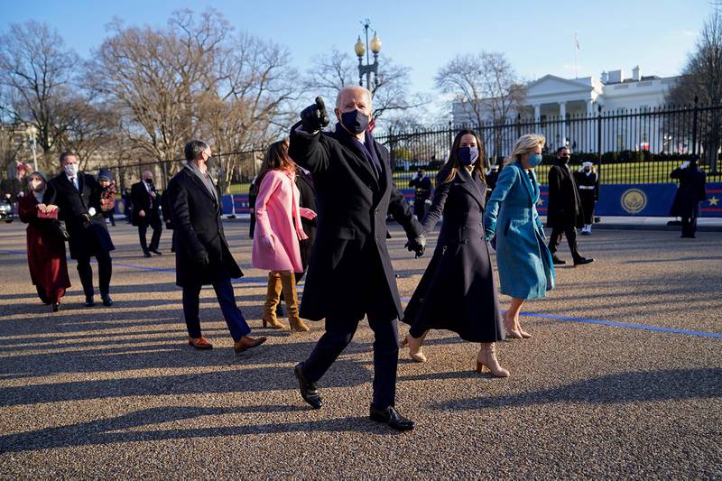 President Joe Biden and first lady Jill Biden walk up Pennsylvania Avenue towards the White House in Washington after Biden and Kamala Harris were sworn in at the Capitol on Jan. 20, 202.