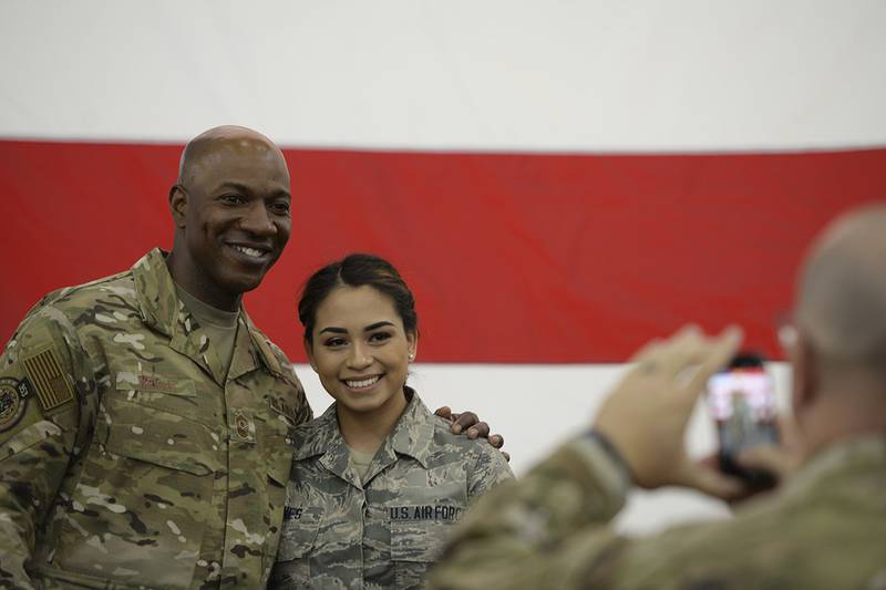 Chief Master Sgt. of the Air Force Kaleth O. Wright poses for a photo with an airman after an all call at Baker Field House on Eielson Air Force Base, Alaska