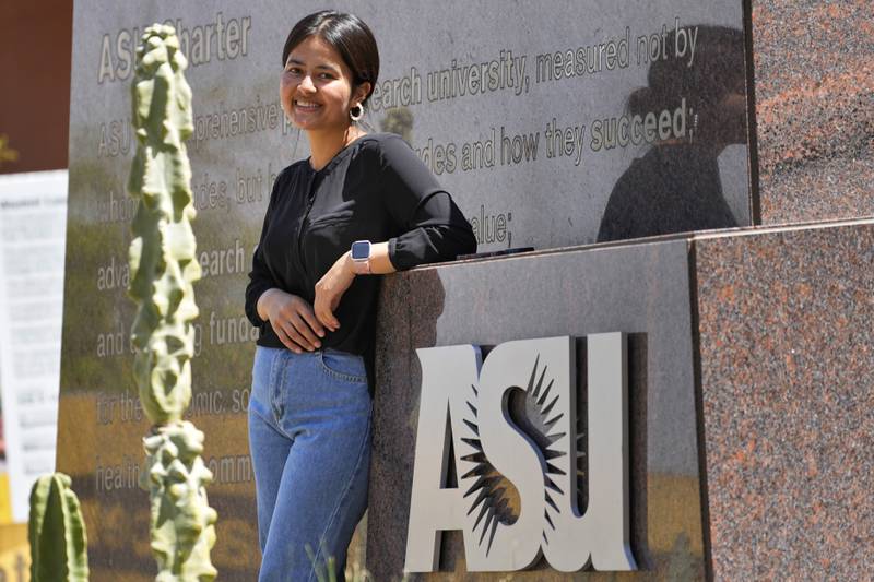 Fahima Sultani stands at the entrance of Arizona State University, Friday, April 7, 2023, in Tempe, Ariz.