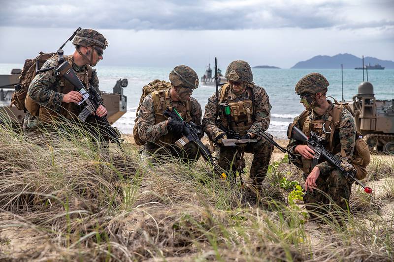 U.S. Marines assess a terrain map during a simulated amphibious assault of exercise Talisman Sabre 19 in Bowen, Australia, July 22, 2019.