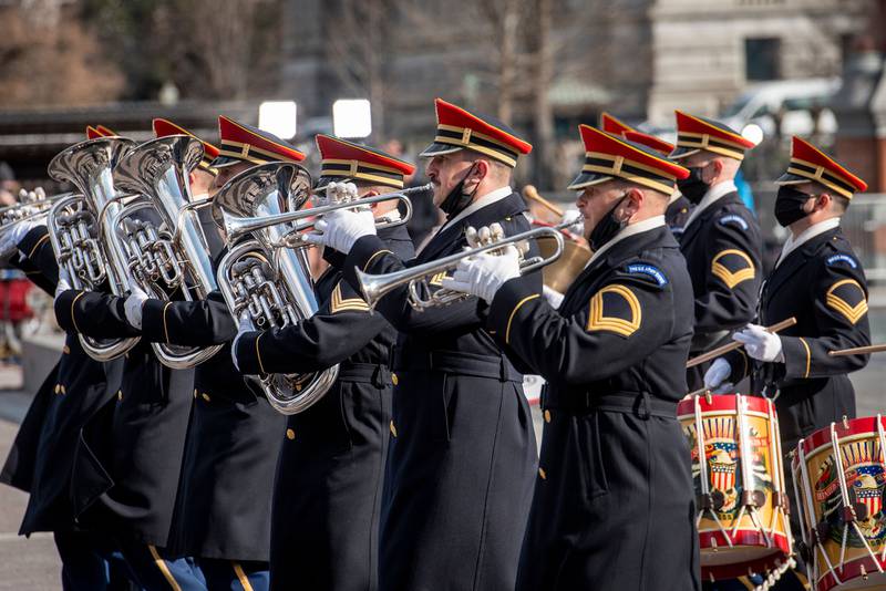 Military bands parade past President Joe Biden and Vice President Kamala Harris as they prepare to depart the Capitol following their taking the Oath of Office as the 46th president and 49th vice president of the United States in Washington on Jan. 20, 2021.