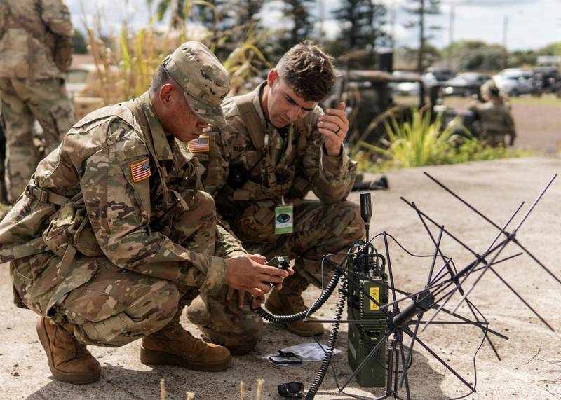 Army soldiers assigned to the 25th Infantry Division, Schofield Barracks, Hawaii, participate in a test of the Navy's Mobile User Objective System (MUOS), a next-generation narrowband satellite communications capability, on May 8, 2019. (Steven Davis/U.S. Navy)