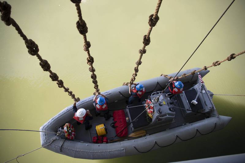 Sailors assigned to USS Gerald R. Ford (CVN 78) are lowered into the water during a small boat operations exercise in Newport News, Va., July 10, 2019.
