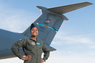 Airman 1st Class Savannah Ferguson, 9th Airlift Squadron loadmaster, celebrates Black History Month by representing various minority groups at Dover Air Force Base, Delaware, Feb. 17, 2021. The daughter of a Puerto Rican mother and Jamaican father, Ferguson grew up as a bridge between Hispanic and African-American cultures. After being assigned to Dover Air Force Base, Ferguson recognized that she had a personal responsibility as a female, Hispanic and African American airman within a predominantly white, male career field to share her experiences. (Mauricio Campino/Air Force)