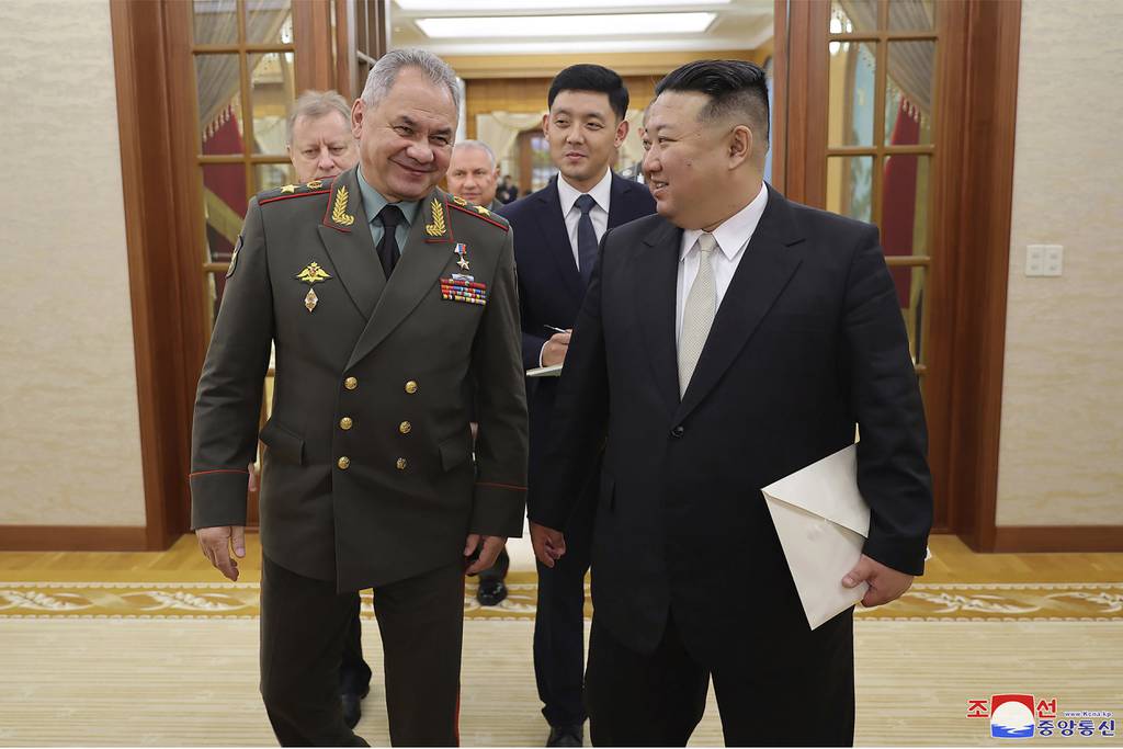 In this photo provided by the North Korean government, North Korean leader Kim Jong Un, right, meets with Russian Defense Minister Sergei Shoigu at the headquarters of the ruling Workers’ Party’s Central Committee in Pyongyang, North Korea Wednesday, July 26, 2023.