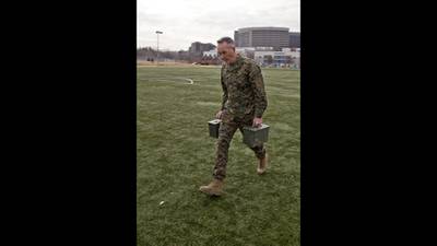 Then-Commandant of the Marine Corps Gen. Joseph Dunford Jr. transports two 30-pound ammunition cans during his Combat Fitness Test in Washington on Dec. 15, 2014.
