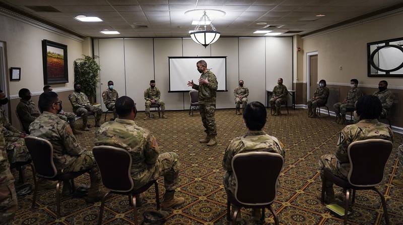 Sergeant Major of the Army Michael Grinston, center, gets feedback from soldiers about their concerns at Fort Hood, Texas, Thursday, Jan. 7, 2021.