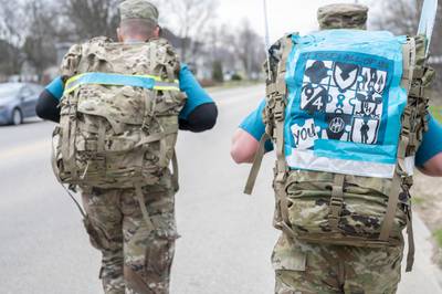 Soldiers lead a Sexual Assault Awareness and Prevention Month Ruck March April 29, 2022, in Sparta, Wis.