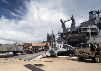 Army vehicles and assets are moved onto a vessel during exercise Dragon Lifeline on July 31, 2018, at the Federal Law Enforcement Training Center in Charleston, S.C.