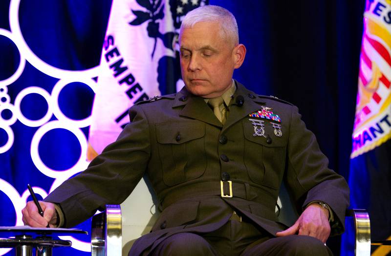 U.S. Marine Corps Brig. Gen. David Walsh, the leader of Marine Corps Systems Command, takes note during a discussion at the Sea-Air-Space conference in National Harbor, Maryland, on April 4, 2023.