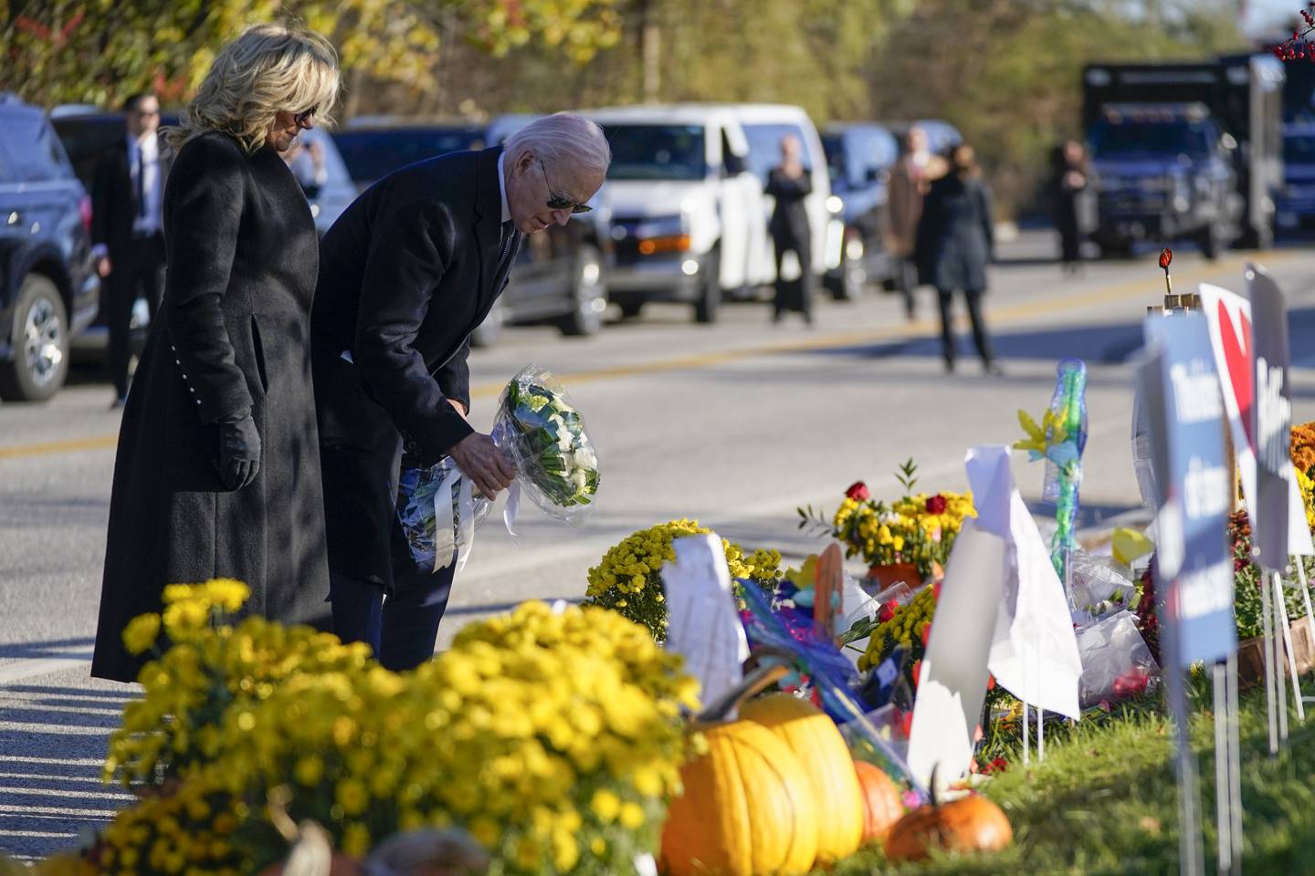 President Joe Biden and first lady Jill Biden lay flowers at Schemengees Bar and Grille, one of the sites of last week's mass shooting, Friday, Nov. 3, 2023, in Lewiston, Maine.