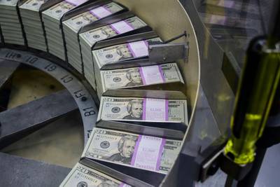 Packs of freshly printed $20 bills are processed for bundling and packaging at the U.S. Treasury's Bureau of Engraving and Printing in Washington on July 20, 2018.