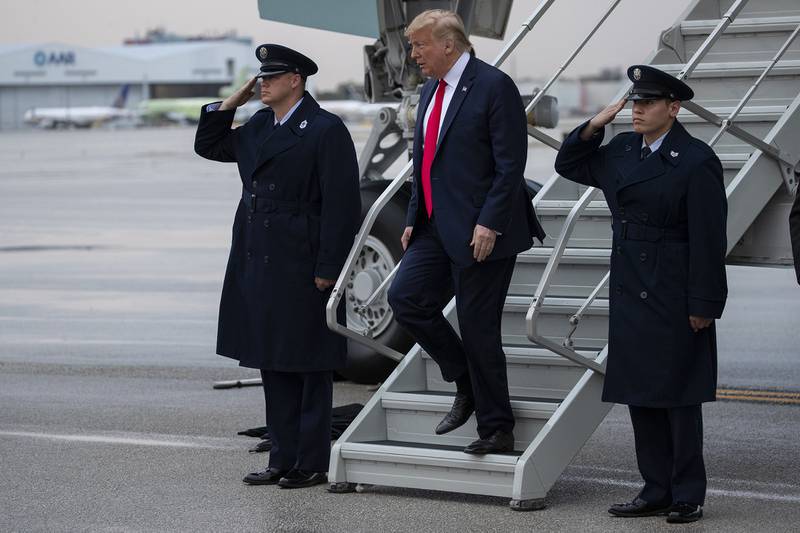 President Donald Trump arrives at Miami International Airport